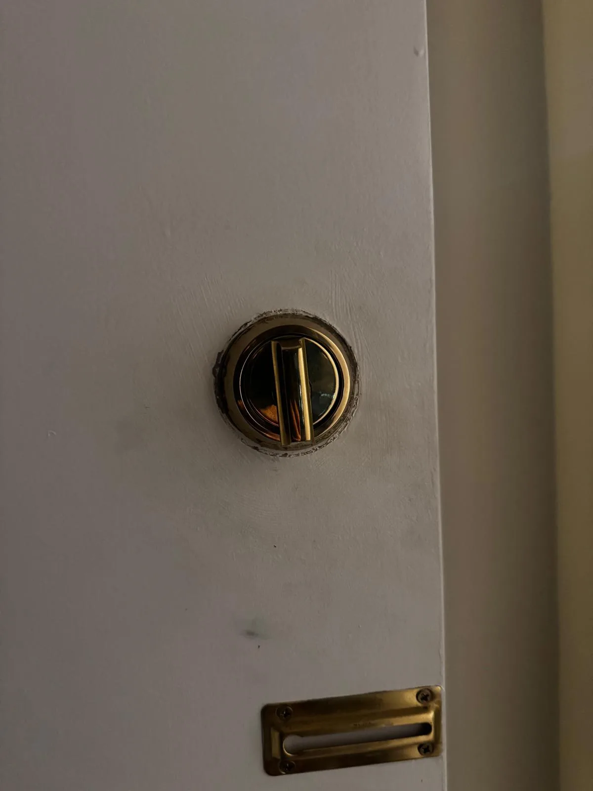 Door deadbolt cylinder being removed for locksmith service