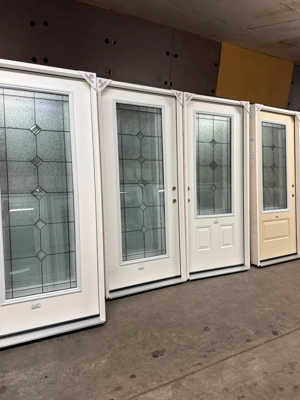 Selection of glass-panel exterior doors stored in the warehouse