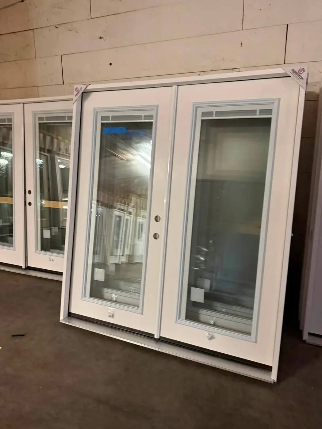 Tall glass-panel doors in the warehouse