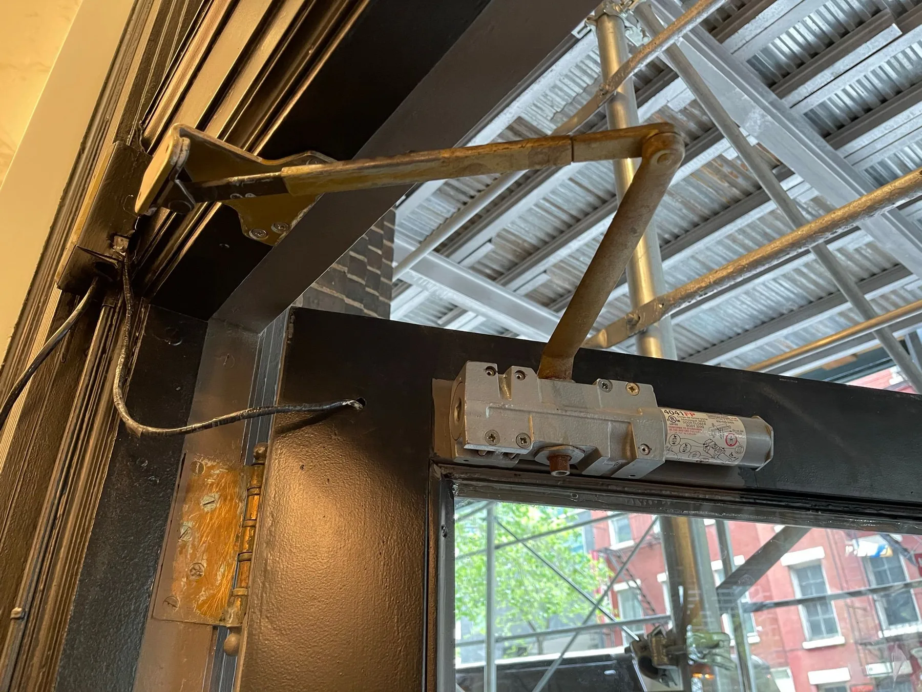 Glass door overhead closer arm