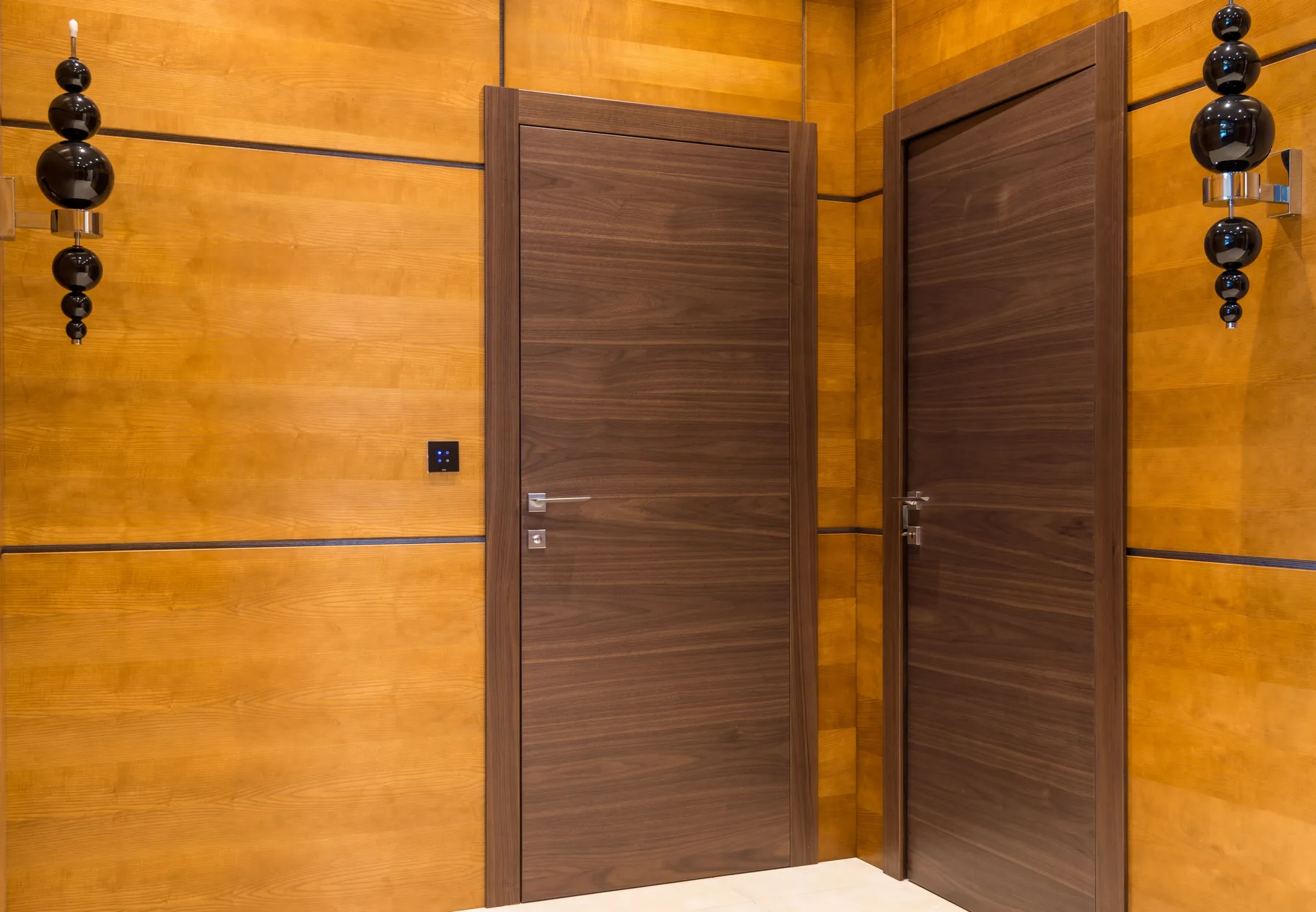 Black entry door in modern hall