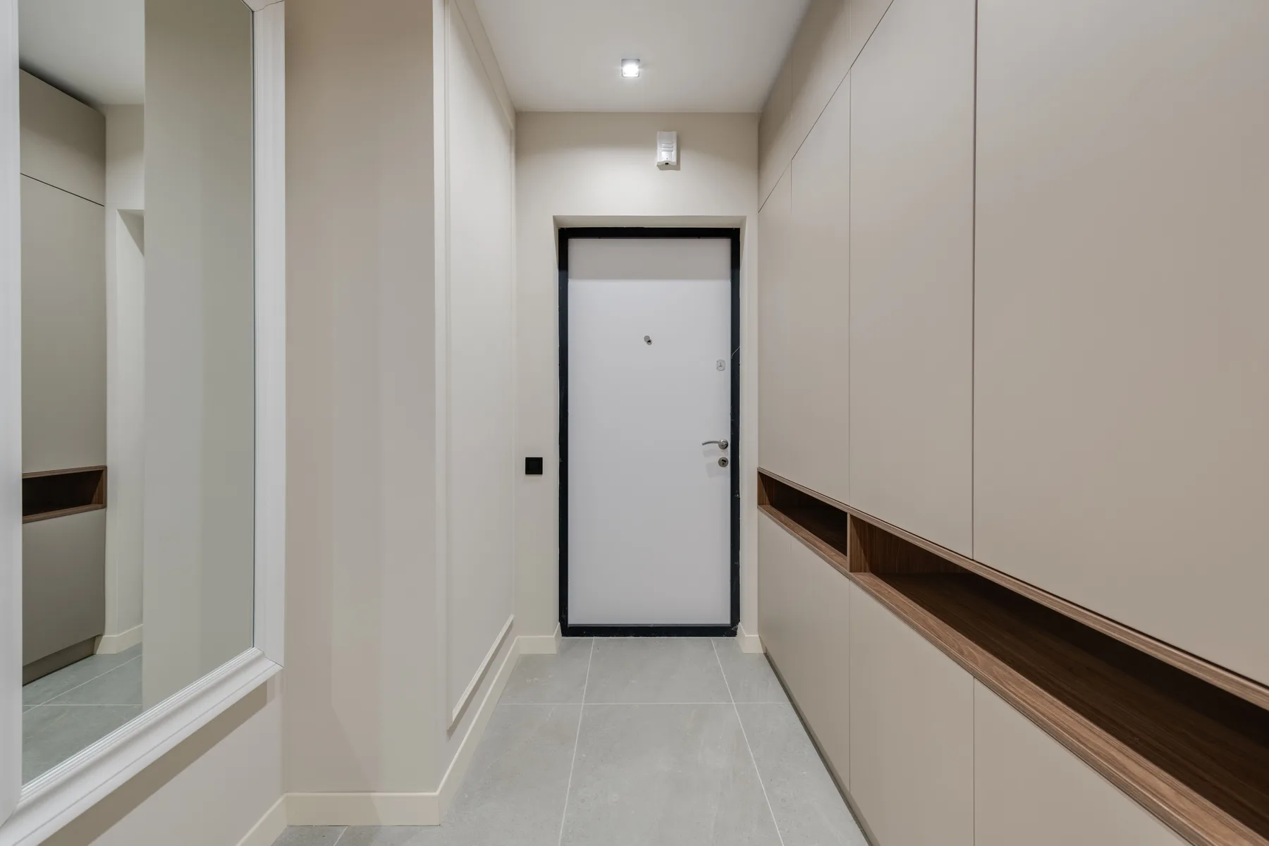 Gray entry door bright hallway