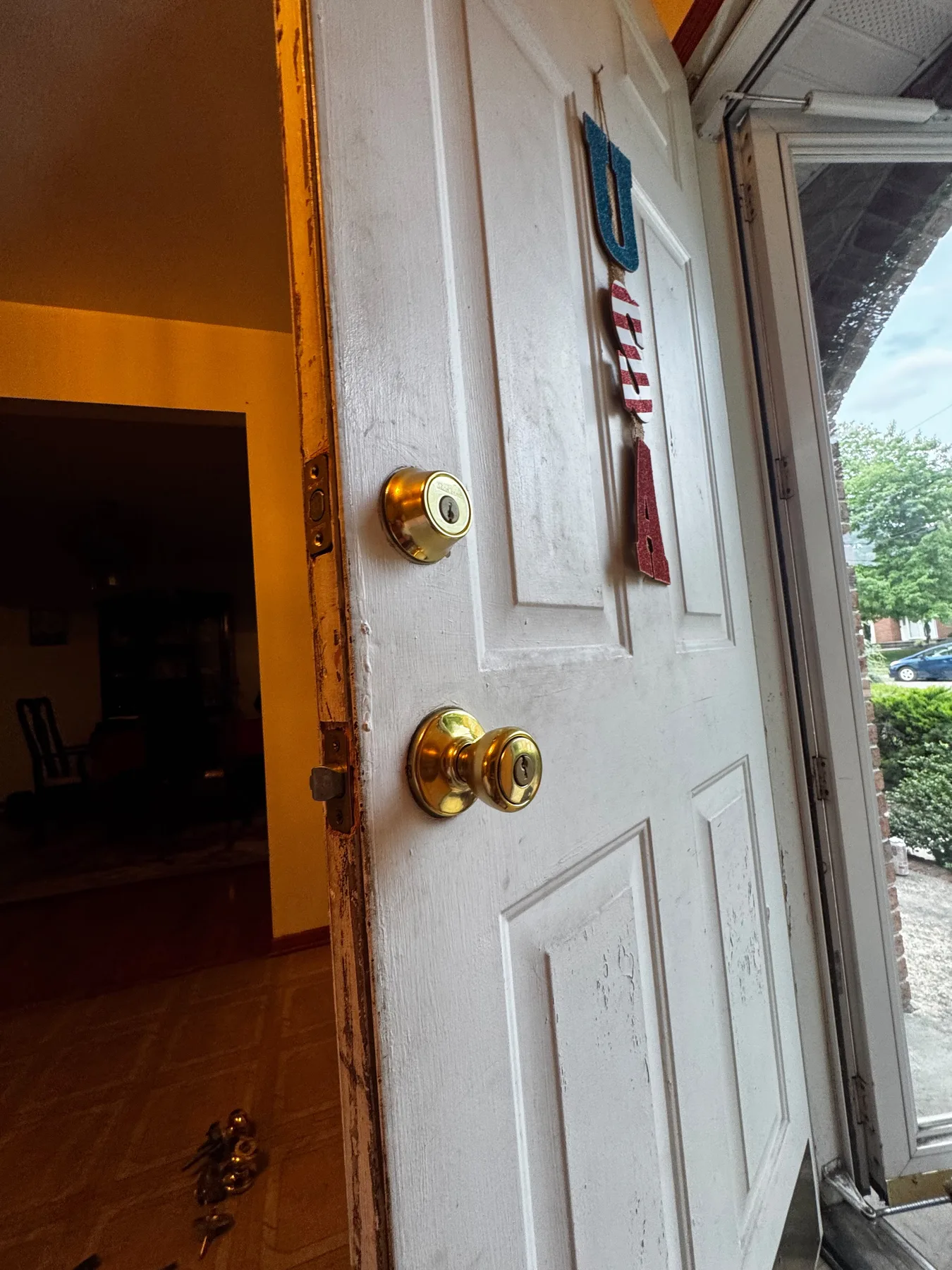 White glazed door brass lock closeup