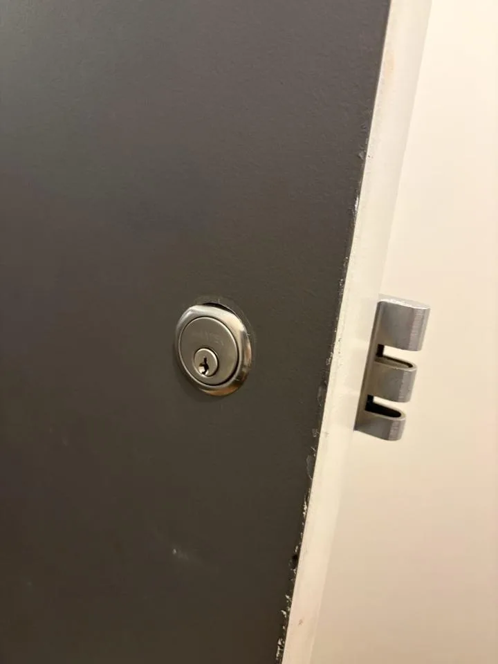 Black entry door lock and strike