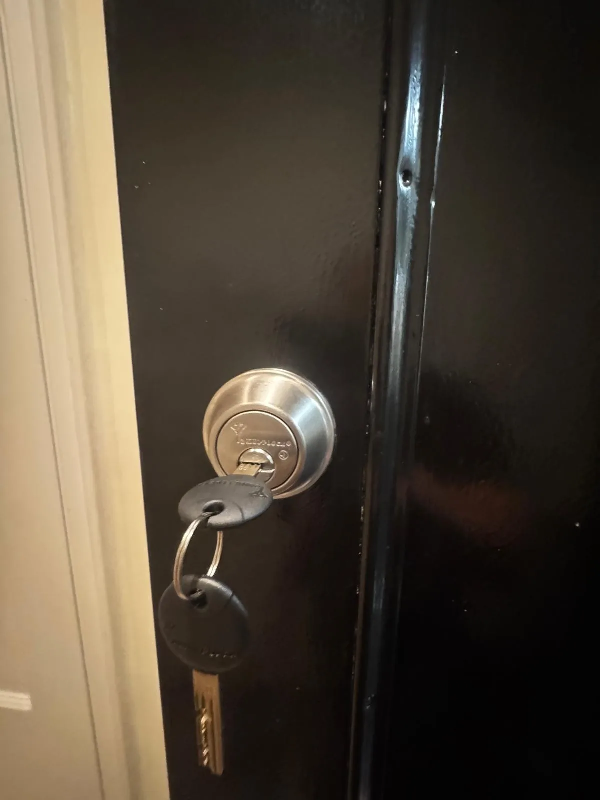 Dark door deadbolt lock installed