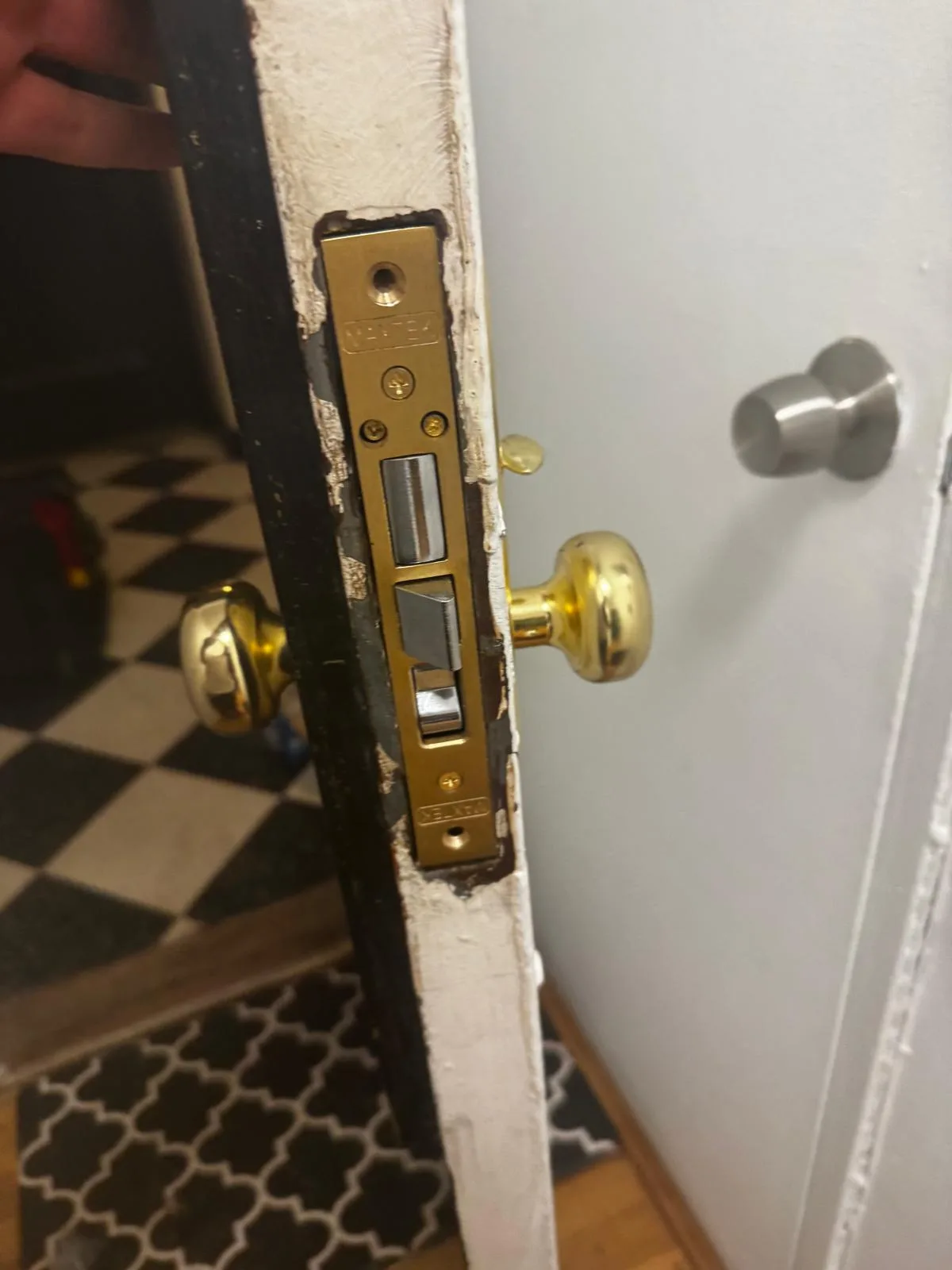 Mortise lock mechanism on white door