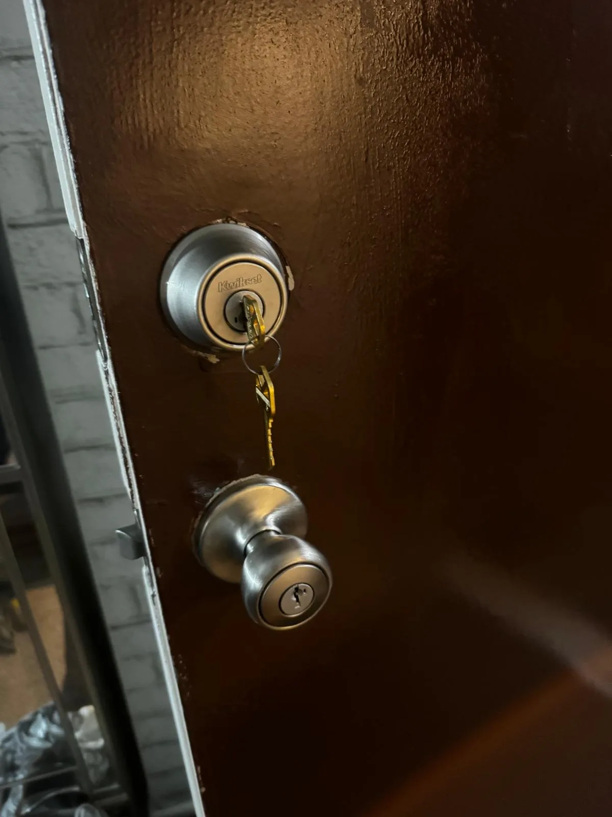 Residential deadbolt and knob on wood door